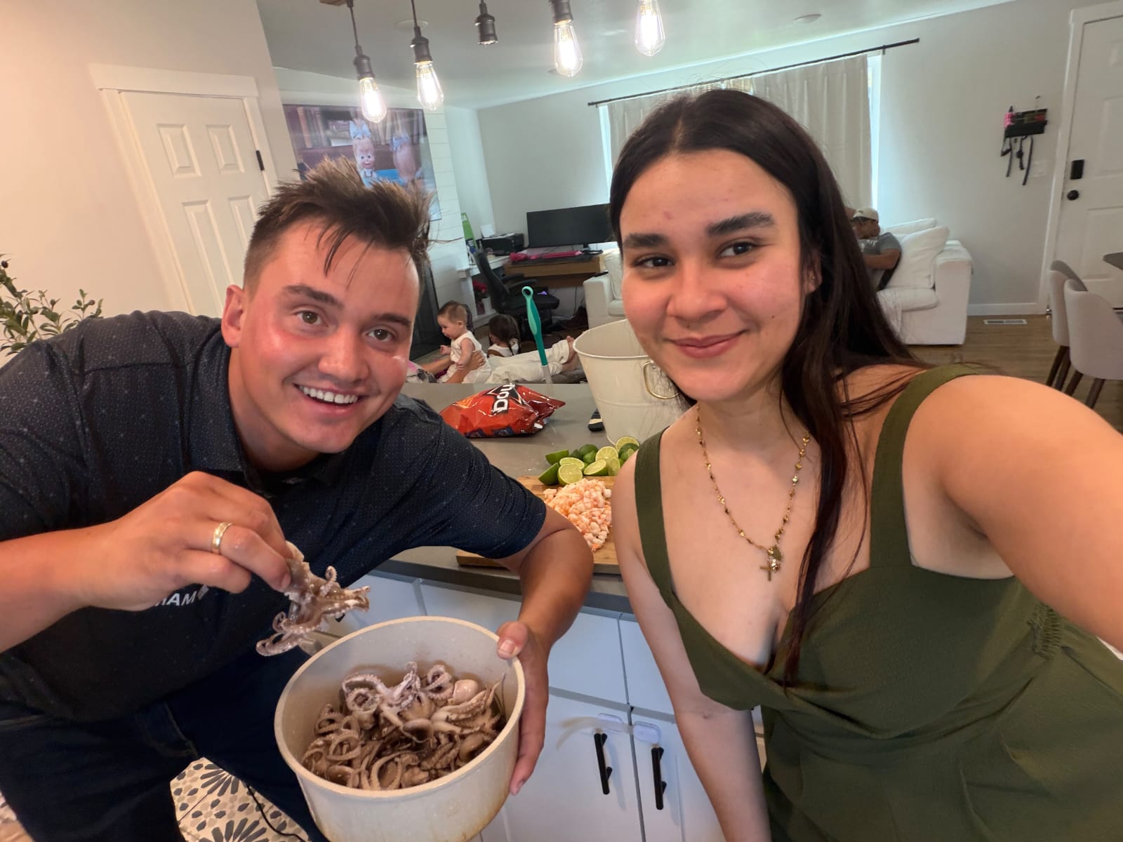 The two founders smiling together in a home kitchen